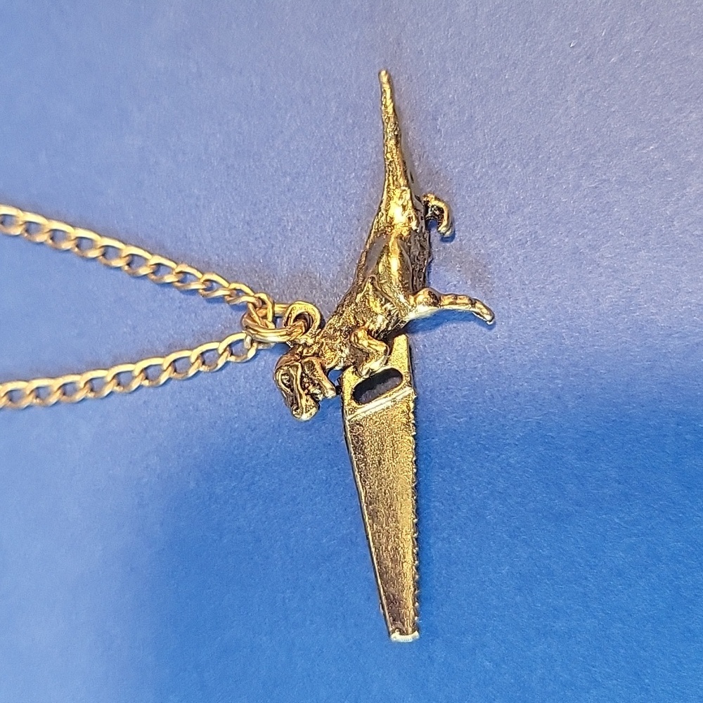 T-Rex Dinosaw Necklace from Brooklyn Charm.  Pendant measures about 1.5 inches.